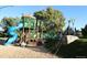 Fun playground with slides and climbing structures, set in a safe, wood chip-covered area, perfect for play at 1936 S Poplar St, Denver, CO 80224