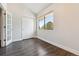Bright bedroom with large closet, french doors, and large window, offering ample space at 1820 Newland Ct # 210, Lakewood, CO 80214