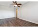 Cozy bedroom featuring neutral walls, wood floors, and ceiling fan with overhead lighting at 1820 Newland Ct # 210, Lakewood, CO 80214