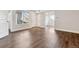 Modern living room with neutral walls, wood floors, large windows and an open-concept layout at 1820 Newland Ct # 210, Lakewood, CO 80214