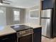 Modern kitchen featuring stainless steel appliances and a spacious countertop at 2238 Newton St, Denver, CO 80211