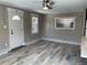 An open concept living room featuring hardwood floors and natural light at 2238 Newton St, Denver, CO 80211