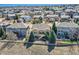 A home with a big backyard surrounded by a white fence in a suburban neighborhood at 7009 Winter Ridge Pl, Castle Pines, CO 80108