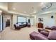 Finished basement with a projector, large screen, ample seating, and neutral carpeting at 7009 Winter Ridge Pl, Castle Pines, CO 80108