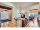 Spacious foyer with hardwood floors, featuring access to the dining room, and a grand entryway at 7009 Winter Ridge Pl, Castle Pines, CO 80108