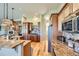 Gourmet kitchen features granite countertops, stainless steel appliances, and custom cabinetry at 7009 Winter Ridge Pl, Castle Pines, CO 80108