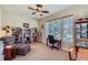Bright office with natural light, built-in bookshelves, and a comfortable workspace at 7009 Winter Ridge Pl, Castle Pines, CO 80108