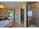 Bright bathroom featuring a separate glass shower and soaking tub at 25994 E Peakview Pl, Aurora, CO 80016