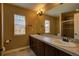Bathroom with double sink vanity, large mirror and tiled shower at 25994 E Peakview Pl, Aurora, CO 80016