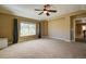 Primary bedroom with vaulted ceiling, carpet and large window at 25994 E Peakview Pl, Aurora, CO 80016