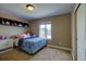 Bedroom with a large window and a built-in shelving unit at 25994 E Peakview Pl, Aurora, CO 80016