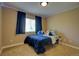 Bedroom featuring a large window with bright natural light and blue curtains at 25994 E Peakview Pl, Aurora, CO 80016
