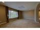 Bright bedroom with window, neutral colors, and carpeting at 25994 E Peakview Pl, Aurora, CO 80016