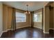 Bright dining space featuring hardwood floors, natural light, and neutral wall paint at 25994 E Peakview Pl, Aurora, CO 80016