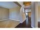 Open foyer featuring neutral tones, carpeted living room, and hardwood floors at 25994 E Peakview Pl, Aurora, CO 80016