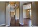 Elegant foyer featuring hardwood floors, staircase, and well-lit dining area at 25994 E Peakview Pl, Aurora, CO 80016