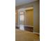 Open-concept hallway showcasing archway, hardwood floors, and neutral paint scheme at 25994 E Peakview Pl, Aurora, CO 80016