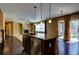 Well-appointed kitchen with a center island, modern appliances, and seamless access to the living area at 25994 E Peakview Pl, Aurora, CO 80016