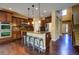 Modern kitchen featuring stainless steel appliances, a breakfast bar, and ample cabinet space at 25994 E Peakview Pl, Aurora, CO 80016