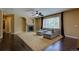 Spacious living room showcasing fireplace, neutral carpet, and hardwood floors at 25994 E Peakview Pl, Aurora, CO 80016