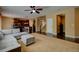 Open-concept living room seamlessly connects to the kitchen, offering an ideal space for entertaining and everyday living at 25994 E Peakview Pl, Aurora, CO 80016