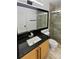 Modern bathroom featuring a glass shower, decorative tile, and granite countertops on new vanity at 19512 E 58Th Dr, Aurora, CO 80019