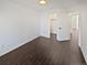 A bedroom features hardwood floors with a closet and doors that lead to different rooms in the house at 19512 E 58Th Dr, Aurora, CO 80019