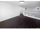 Bonus room with tile floors, neutral walls and staircase to the first floor at 19512 E 58Th Dr, Aurora, CO 80019