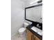 Modern powder room featuring a new vanity with a granite countertop and updated fixtures at 19512 E 58Th Dr, Aurora, CO 80019