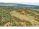 Expansive mountain property with a modern home surrounded by trees and breathtaking views at 5166 Bear Mountain Dr, Evergreen, CO 80439