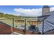 Outdoor balcony overlooking lush trees, perfect for enjoying nature and relaxation in a serene setting at 5166 Bear Mountain Dr, Evergreen, CO 80439