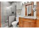Modern bathroom featuring a glass shower, updated vanity, and stylish fixtures at 5166 Bear Mountain Dr, Evergreen, CO 80439