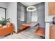 A cozy dining area featuring a floating table, benches, modern lighting, and stylish decor at 5166 Bear Mountain Dr, Evergreen, CO 80439