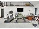 Spacious garage featuring an exercise area with modern equipment and a loft space above at 5166 Bear Mountain Dr, Evergreen, CO 80439