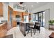 Spacious kitchen with an island, stainless steel appliances, wooden cabinets and breakfast bar seating at 5166 Bear Mountain Dr, Evergreen, CO 80439