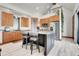 Bright kitchen featuring a large island, stainless steel appliances, and an open layout at 5166 Bear Mountain Dr, Evergreen, CO 80439