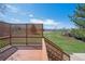 A view of the backyard from the back deck showing lush green grass and mountains in the distance at 7158 W Roxbury Ave, Littleton, CO 80128