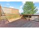 Spacious back deck featuring wood railings and lattice, ideal for outdoor enjoyment at 7158 W Roxbury Ave, Littleton, CO 80128