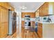 Spacious kitchen features stainless steel appliances, hardwood floors, ample cabinetry, and a functional layout at 7158 W Roxbury Ave, Littleton, CO 80128
