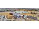 An aerial perspective showcases amenities, including a pond and playground at 17922 E 104Th Pl # D, Commerce City, CO 80022