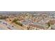 Picturesque aerial view of the community, showcasing pond, streets and homes at 17922 E 104Th Pl # D, Commerce City, CO 80022