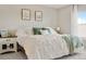 Cozy bedroom featuring a plush bed with a side table and a view at 17922 E 104Th Pl # D, Commerce City, CO 80022