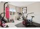 Home gym featuring a pink Everlast punching bag and exercise equipment at 17922 E 104Th Pl # D, Commerce City, CO 80022