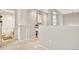 Bright hallway with carpet, leading to a bathroom with shower/tub combo at 17922 E 104Th Pl # D, Commerce City, CO 80022