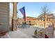 Charming patio with stone accents, seating area and decorative rock garden at 17922 E 104Th Pl # D, Commerce City, CO 80022