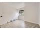 Empty room with wood-look flooring and large window at 3363 Oneal Pkwy # 36, Boulder, CO 80301