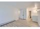 Spacious bedroom with laminate floors and white walls, showing the multiple doorways to the closet and bathroom at 3363 Oneal Pkwy # 36, Boulder, CO 80301