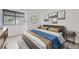 Stylishly staged bedroom with large window and modern decor at 3363 Oneal Pkwy # 36, Boulder, CO 80301