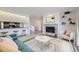 Cozy living room showcasing stone fireplace, built-in shelves and adjacent eat-in kitchen at 3363 Oneal Pkwy # 36, Boulder, CO 80301
