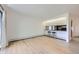 Bright living room featuring bar counter with stools and light wood-look flooring at 3363 Oneal Pkwy # 36, Boulder, CO 80301
